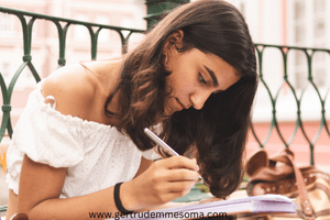 Emotionally-disconnected-woman-writing-her-goals